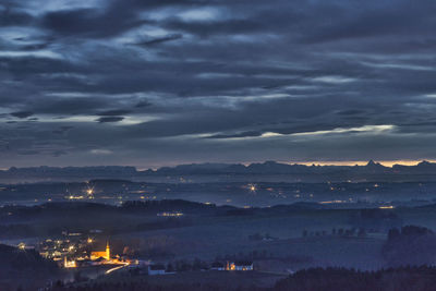 Aerial view of illuminated city at night