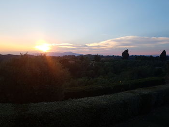 Scenic view of field against sky during sunset