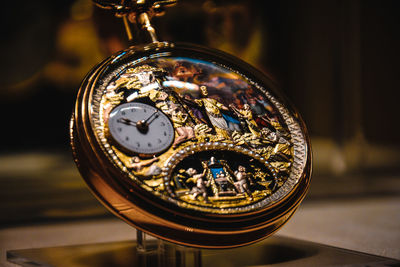 Close-up of clock on table