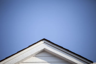 Low angle view of building against clear blue sky