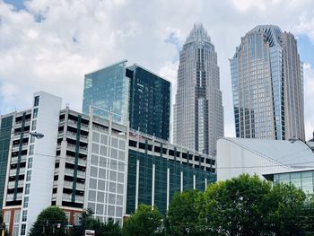 Low angle view of modern buildings against sky