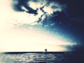 Scenic view of sea against cloudy sky