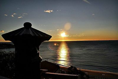 Scenic view of sea at sunset