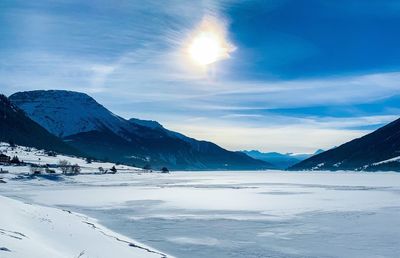 Scenic view of snowcapped mountains against sky