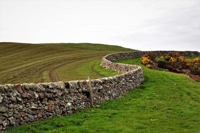 Scenic view of land against sky