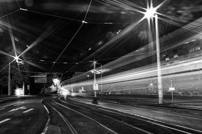 Light trails on railroad track at night