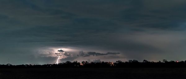 Scenic view of field against sky at night