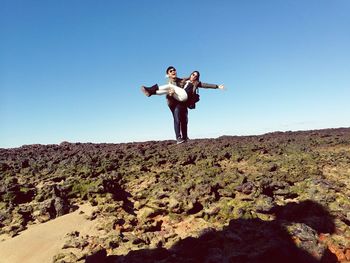 Low angle view of a woman jumping