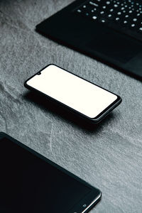 Close-up of mobile phone on table