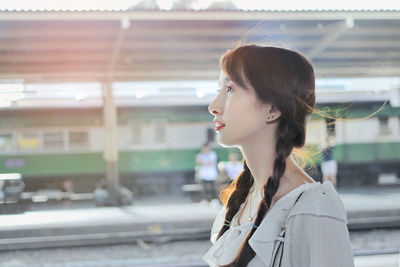 Portrait of a young woman looking away