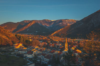 A panoramic wide landscape view of veynes, an old town in the french alps, during the sunset