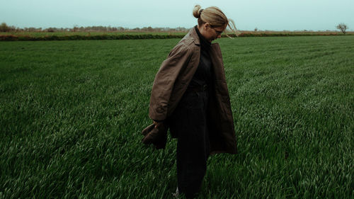 Woman standing on field