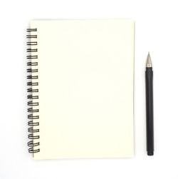Directly above shot of open book against white background