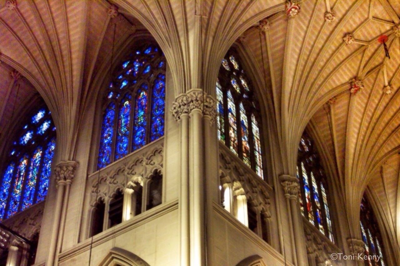 LOW ANGLE VIEW OF ORNATE WINDOW IN TEMPLE