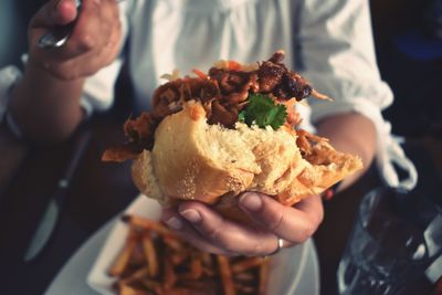 Midsection of person holding food