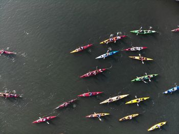High angle view of people on kayaks in river