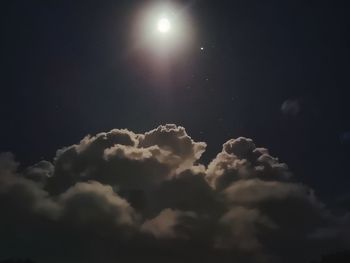 Low angle view of moon in sky at night