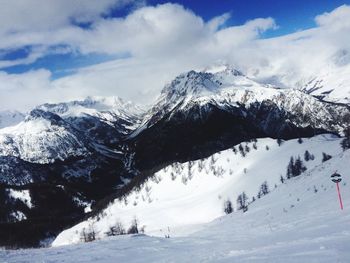 Scenic view of mountains against sky during winter