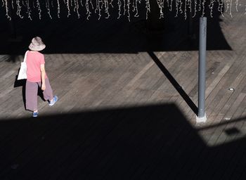 Girl walking on footpath