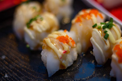 Close-up of sushi served on table