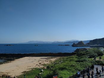 Scenic view of sea against clear blue sky