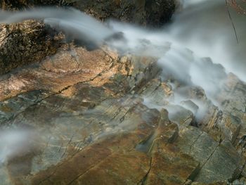 Aerial view of water flowing through rocks