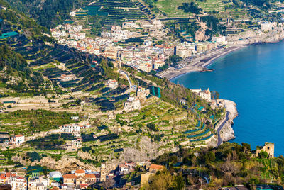 High angle view of townscape by sea