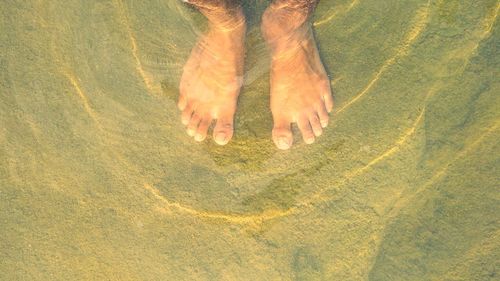 Feets in water very abstract form of water