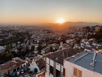 High angle view of townscape against sky during sunset