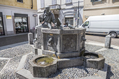 Statue of fountain in city building