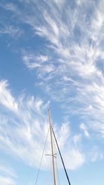 Beautiful sky with feathery clouds and a mast. can be used as background.