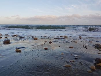 Scenic view of sea against cloudy sky