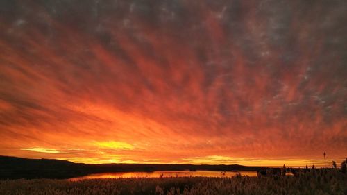 Scenic view of dramatic sky over land