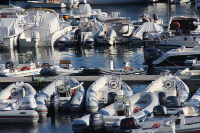 Boats moored at harbor