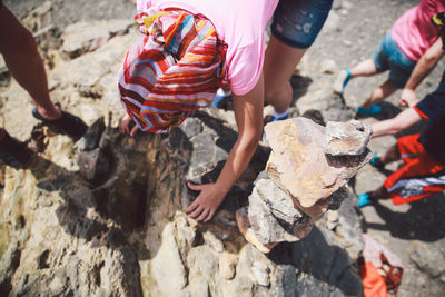 Close-up of woman stacking rocks