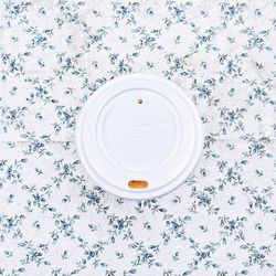 Directly above shot of disposable cup on table