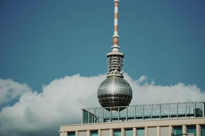 Low angle view of fernsehturm tower against sky