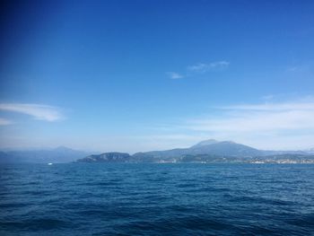 Scenic view of sea against blue sky