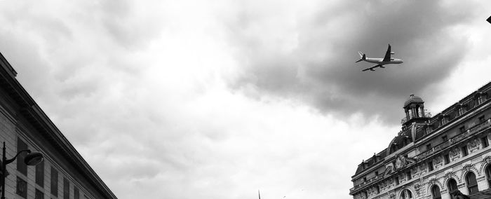 Low angle view of airplane flying in sky