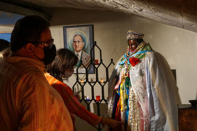 Portrait of people standing against wall