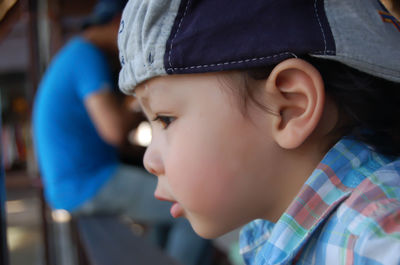 Close-up of cute boy looking away