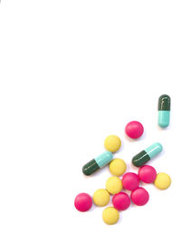 Close-up of multi colored pencils over white background