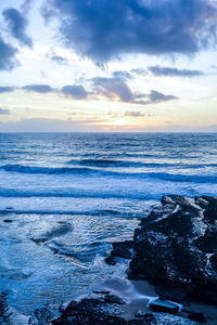 Scenic view of sea against sky during sunset