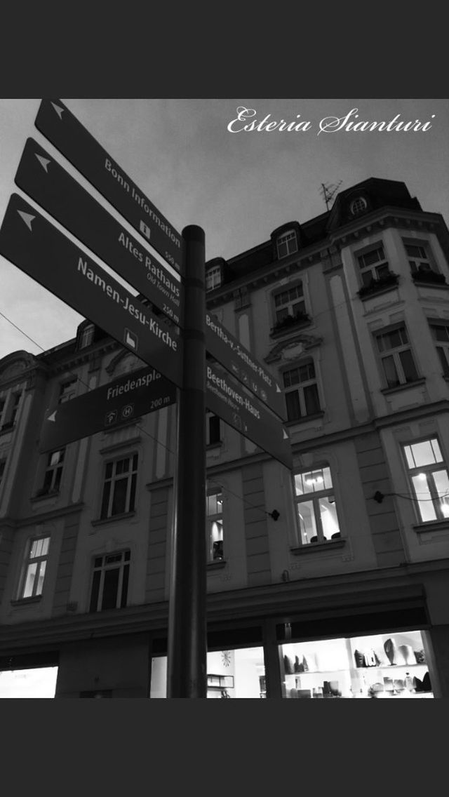 LOW ANGLE VIEW OF ILLUMINATED BUILDINGS AGAINST SKY