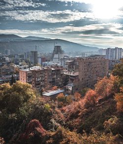 High angle view of buildings in city against sky