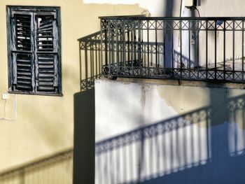 Shadow of railing on building wall