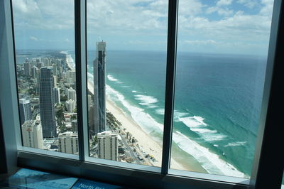 Panoramic view of sea seen through window