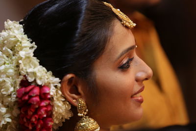 Close-up of young woman with bouquet