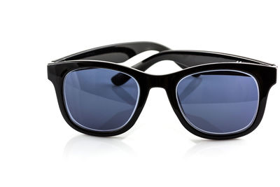 Close-up of sunglasses against white background