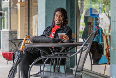 Portrait of smiling man sitting on seat